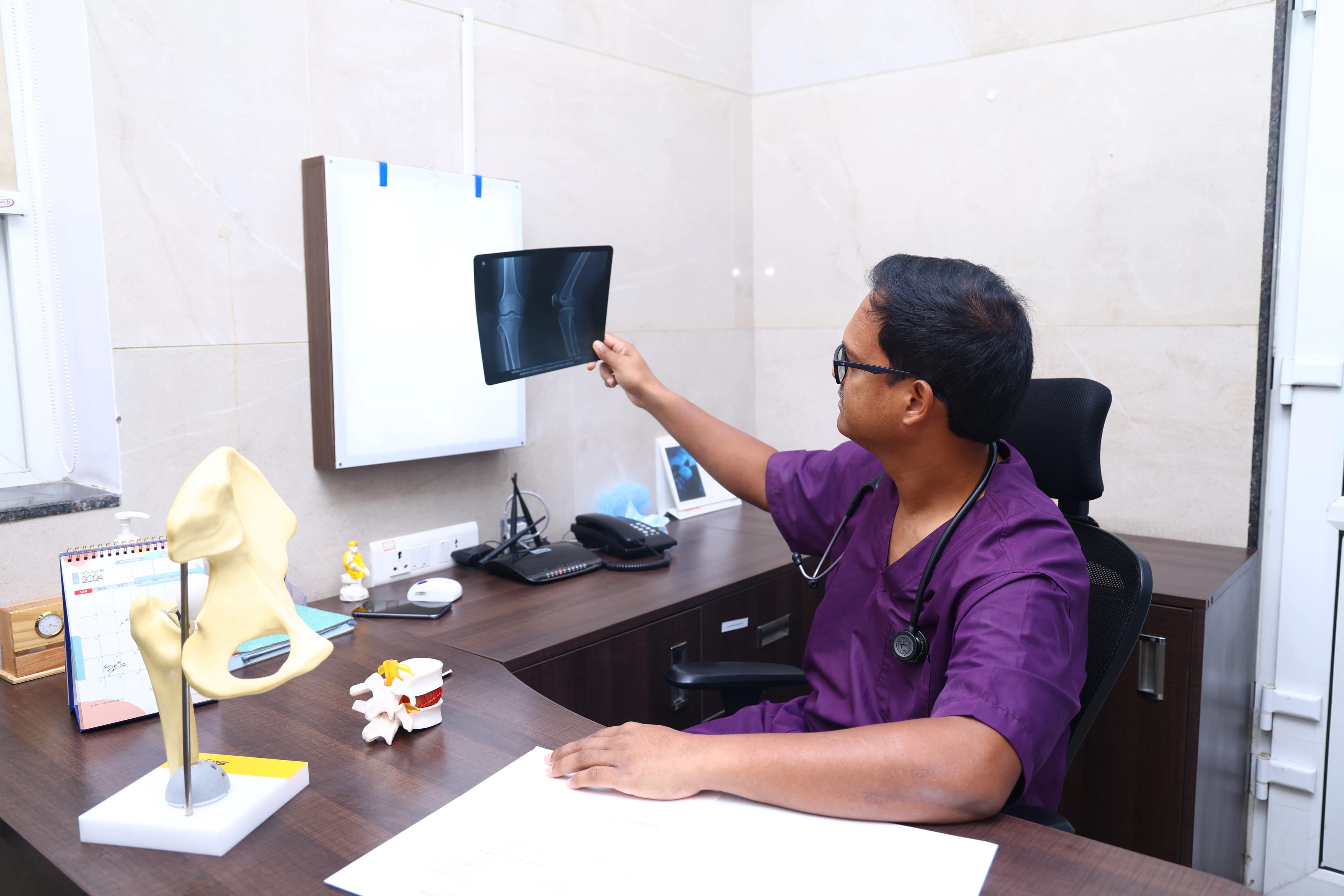 Orthopaedic doctor in Vizag reviewing spine and back imaging